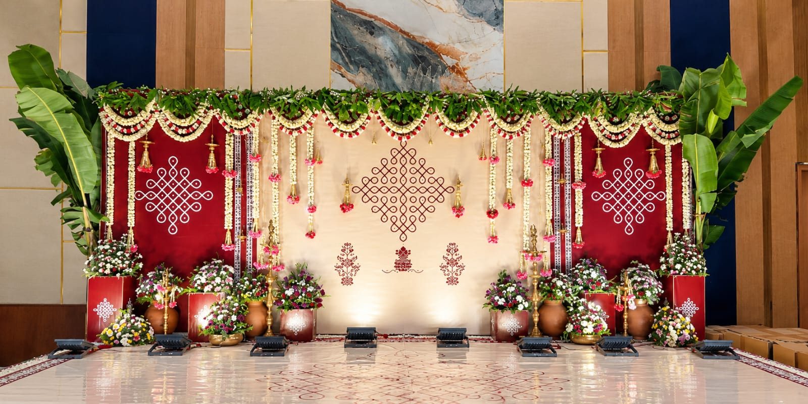 Red and white stage with hanging florals