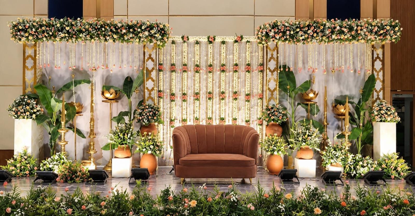 White curtains, palms and floral stage